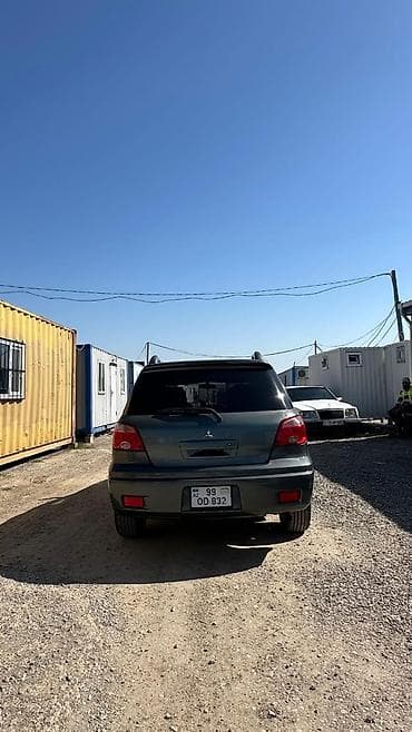 afdobus satiram dizel: Mitsubishi Outlander – tünd boz rəngdə, 5 qapılı kompakt — 7