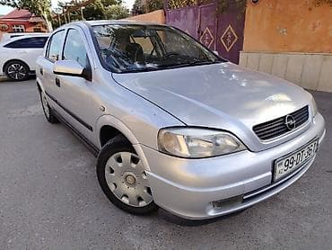 şrus: Opel Astra G sedan – gümüşü rəng Texniki xüsusiyyətlər: - Kuzov: 4 — 9
