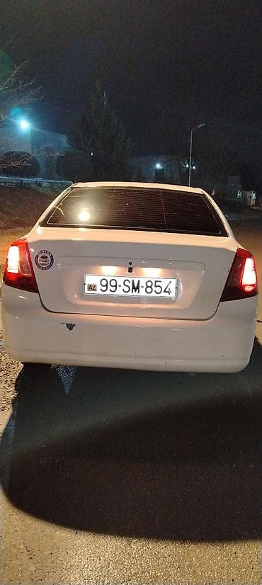 xezer avtomobil satis merkezi: Sedan avtomobil – ağ rəng Model:tipli 4 qapılı sedan Kuzov: ağ rəng — 9