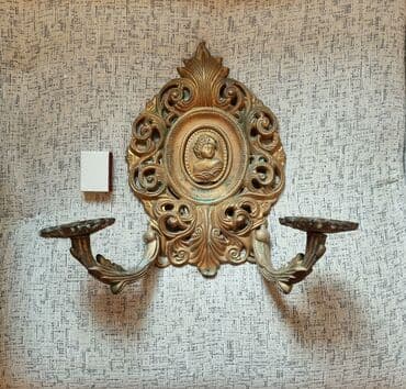 guzgu samdan: Qədimi divardan asılan şamdan. LATUN.
Hündürlük 32 sm.ağırdı — 1