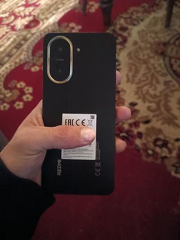 nokia 5 1: Redmi smartfon - Arxa panel: qara rəng, mat tekstura, aşağı hissədə — 1