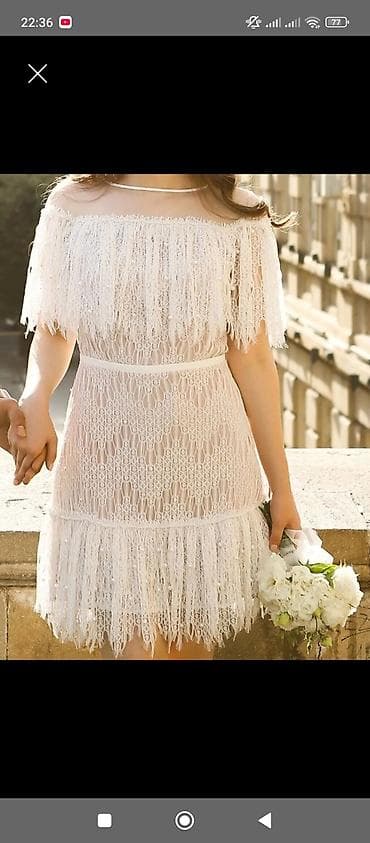 Zərif ağ rəngdə, qısa uzunluqlu off-shoulder krujeva don. Cəmi 1defe