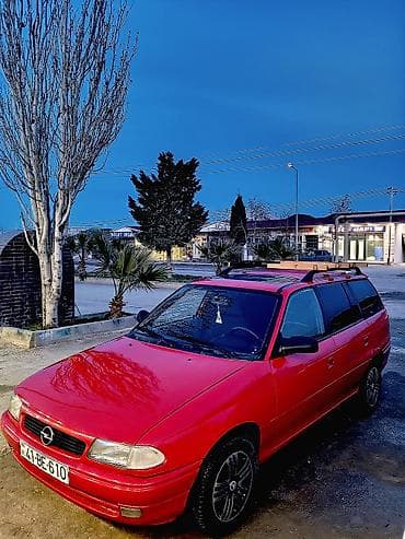 vaz 2107 maşını: Opel Astra F Caravan (universall) – qırmızı rəng. şəxsi sahibiyəm Heç — 5