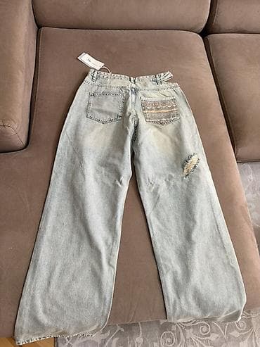 Açıq mavi yuyulmuş effektli, geniş kəsimli cins şalvar. - Model — 4