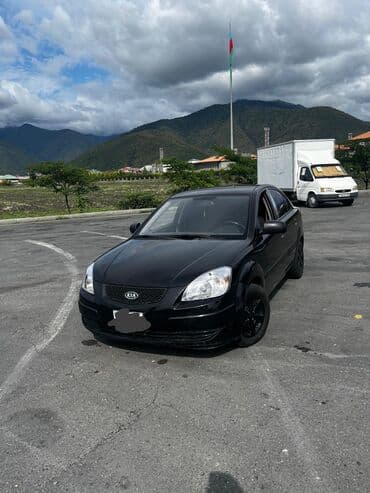 авто подлокотники: Kia Rio: 1.4 л | 2008 г. Седан — 1