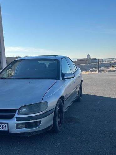 kia optima 2012: Opel Omega: 2 l | 1999 il Sedan — 7
