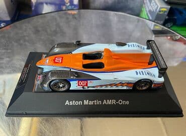 где можно продать марки: Коллекционная модель Aston Martin AMR-One #7 Gulf Team LeMans 2011 — 21
