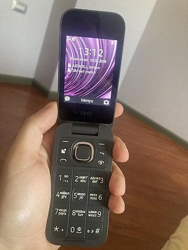 azercell modem satilir: HMD flip telefon Xüsusiyyətlər: - İki ekranlı dizayn: xarici saat/ — 3