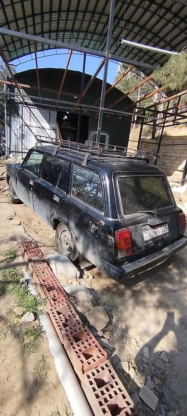 lider disk 17: VAZ 2104 universal, qara rəng. Klassik kuzov, 5 qapı, geniş baqaj — 2