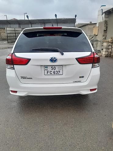 Транспорт: Toyota Corolla Fielder Hybrid – universal kuzovlu, ağ rəng. - Hibrid — 2