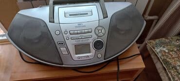 sovet radio: Gümüşü rəngdə, daşıma dəstəyi olan Panasonic RX-D27 portativ CD radio — 1