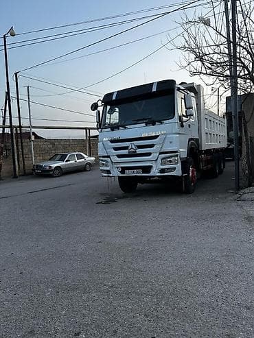 cadir masin: Ağ rəngli 6x4 tipli ağırtonnajlı samosval yük maşını. Texniki — 1