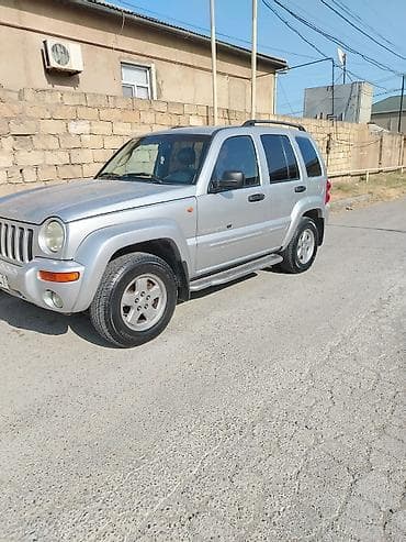 teker cixardan: Jeep Cherokee (Liberty) – gümüşü rəngli, 5 qapı, şəhər və yolsuzluq — 1