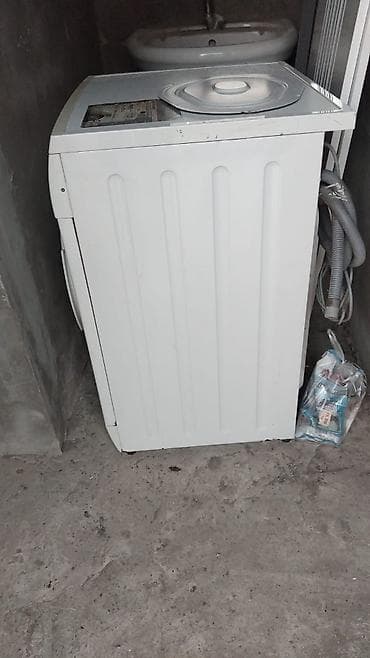 Siemens markalı E 10-16 model ağ rəngli paltaryuyan maşın. Cihazın — 2