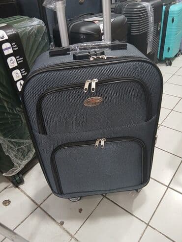 купить чемодан на колесах: Dörd təkərli səyahət çantası, möhkəm materialdan hazırlanmışdır və — 9