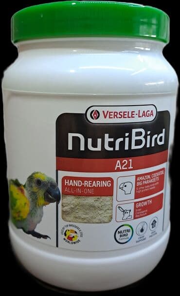 pişik yem: Tutuquşu balalarının əllə bəsləmə maması.Tutuquşu balalarını şprislə — 1