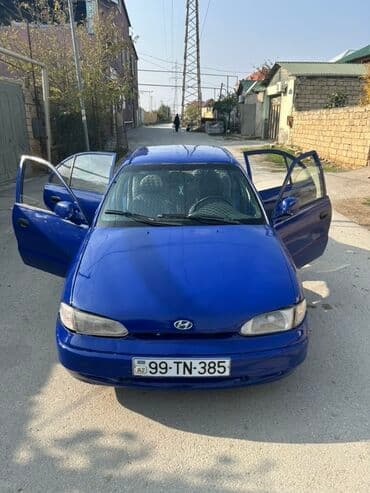 kia sou 2013: Hyundai Accent: 1.5 l | 1995 il Sedan — 3