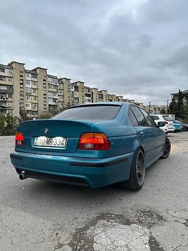 teker cixardan: BMW 5 series: 2.5 l | 1996 il Sedan — 3