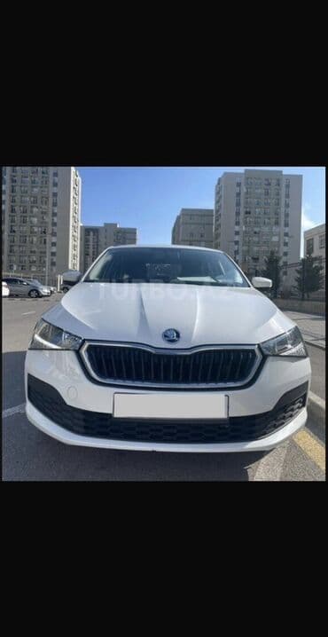 disklər r14: Skoda Rapid – ağ rəngli, şəhər və tras üçün universal sedan. Texniki — 1