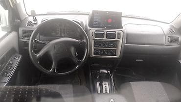 daewoo lanos nece masindir: Mitsubishi Pajero iO (GDI) – ağ rəngli, 5 qapılı kompakt SUV. İlkin — 5