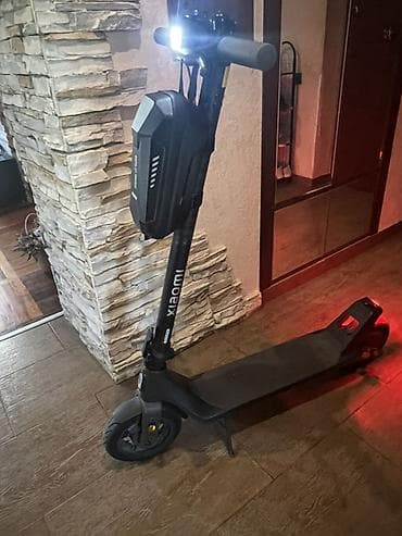 electro gitara: Xiaomi elektrik skuter. Şəkillərdə qara rəngli, minimalist dizayna — 6