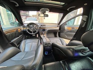 mercedes c190: Mercedes-Benz E‑Class (W211) sedan – qara rəng, AMG üslublu eksteryer — 7