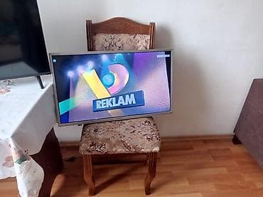 tv box android: LED televizor, gümüş rəng çərçivə, təxminən 32–40 düym ekran. - Geniş — 1