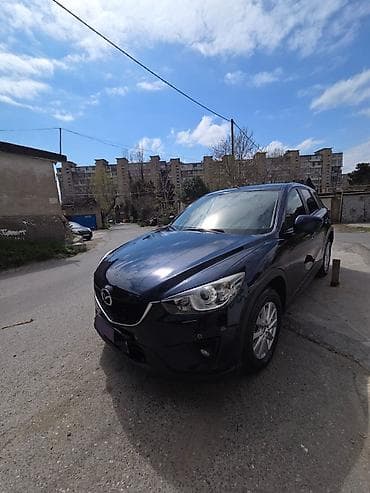 bmw x1 20d xdrive: Mazda CX-5: 2 l | 2014 il Krossover — 8
