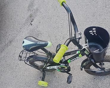 zigzag velosiped: Uşaq velosipedi satılır. Model qara rəngdədir və yaşıl aksentlərlə — 1