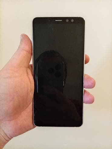 Техника и электроника: Samsung Galaxy A8 2018, 64 ГБ, цвет - Голубой, Отпечаток пальца, Сенсорный, Две SIM карты — 2