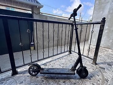 Elektrik skuter – qara rəngli, yığcam və yüngül konstruksiya lalafo.az -da Elektrik skuter – qara rəngli, yığcam və yüngül konstruksiya
