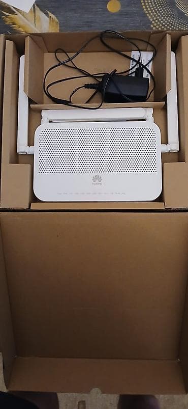 internet data: Huawei optik internet modemi/routeru. Şəkillərdə görünən ağ rəngli — 2