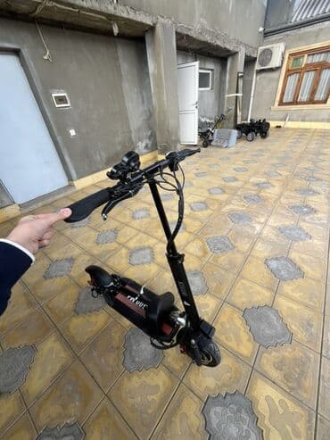 elektro samokat: Elektrikli skuter – şəhər daxili səmərəli hərəkət üçün — 2