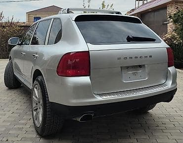 porsche disk: Porsche Cayenne (1-ci nəsil) – gümüşü rəngli SUV ili 2003 mator 4.5 — 3