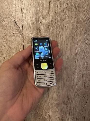 Nokia 6700 Slide, rəng - Gümüşü, Düyməli
