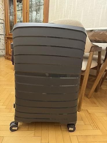 Чемодан темно серого цвета, размер L один раз пользовались, впереди