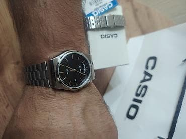 CASIO brendinin gümüşü rəngli metal kəmərli və qara siferblatlı kişi — 2
