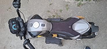 oyuncaq 28may: Uşaq üçün elektrik motosiklet. Boz, qara və sarı rəng — 2