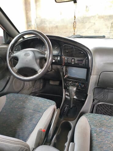 kia forte 2017: Kia Sephia: 1.6 l | 1998 il Sedan — 12