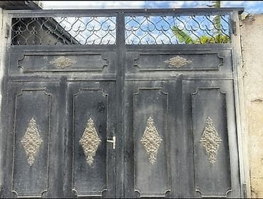 Dəmir darvaza – ikitaylı, üst hissəsi naxışlı dekorativ