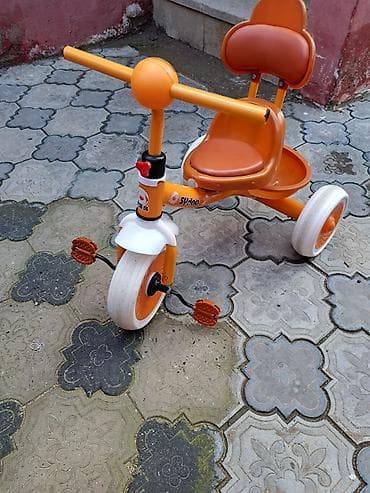 Uşaq üçtəkərli velosiped – narıncı rəngdə. Xüsusiyyətlər: - 3 təkərli