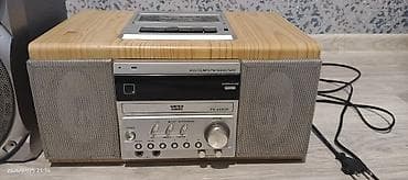 Kompakt musiqi mərkəzi – kaset, CD/VCD və FM/AM radio dəstəyi ilə