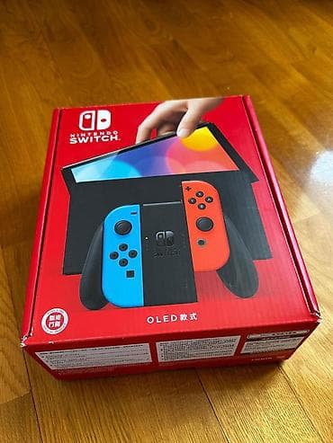 video dvd: Nintendo Switch OLED (neon mavi/qırmızı Joy‑Con) + Batman: Arkham — 2