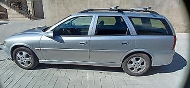 avtomobil kia: Opel Vectra Caravan (universal kuzov), gümüşü rəng - Kuzov: 5 qapılı — 4