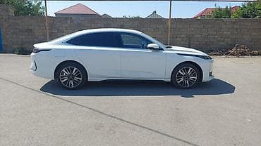 kia servis ehtiyat hisseleri: Elektrik sedan – ağ rəng, aerodinamik fastback kuzov, zərif LED — 3