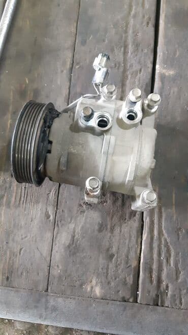 kampresor: Avtomobil kondisionerinin kompressoru. Bu kompressor avtomobilin — 2