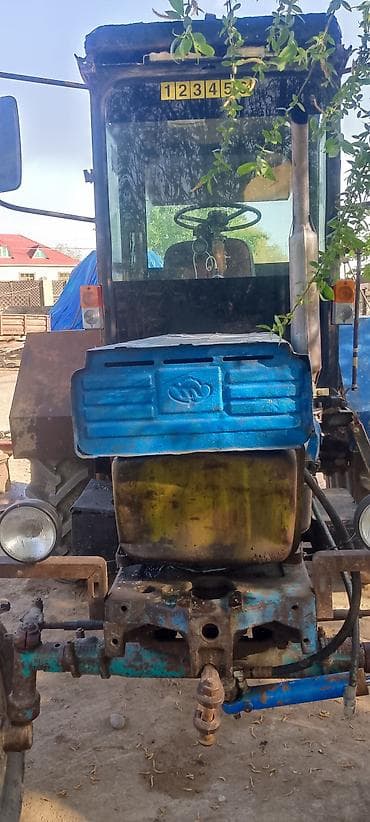 kafe avadanligi: Kənd təsərrüfatı üçün universal təkərli traktor - Kabinli, yan — 4