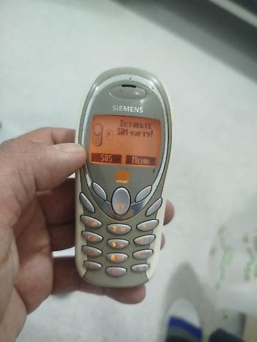 düymeli telefon: Siemens A55 mobil telefon - Klassik monoxrom ekran, narıncı arxa — 1