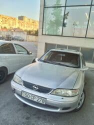 ferrari qiymeti: Opel Vectra: 1.8 l | 1998 il 337000 km Sedan — 4