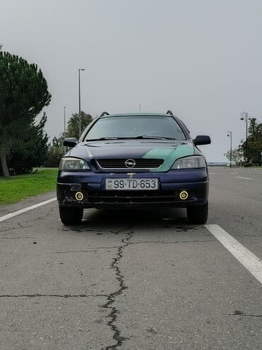 опель астра универсал: Opel Astra Caravan (universal) – mavi rəngli, ön tərəfdən geniş — 4